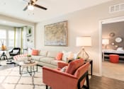 Thumbnail 15 of 30 - furnished model apartment with hardwood-inspired flooring