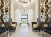 Thumbnail 3 of 44 - Lobby with private conversation nooks and luxury furnishings at Residences at The Green in Lakewood Ranch, FL