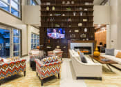 Thumbnail 24 of 42 - Comfortable couches and chairs in resident lounge  at LandonHouse in Lake Nona