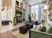 Thumbnail 7 of 44 - Lounge area with TVs and couches  in Bradenton, FL 34211