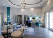 Thumbnail 3 of 19 - a living room with grey walls and a chandelier hanging from the ceiling  at The Madison Franklin, Franklin