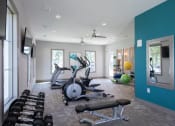 Thumbnail 8 of 19 - a home gym with a blue accent wall  at The Madison Franklin, Franklin, 37064