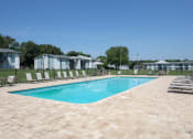 Thumbnail 5 of 19 - a large swimming pool with lounge chairs and umbrellas around it at The Madison Franklin, Franklin
