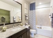 Thumbnail 16 of 42 - Master bath with tile and granite  at LandonHouse Apartments in Lake Nona, Orlando, FL 32827