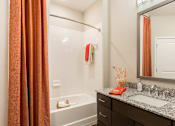 Thumbnail 23 of 30 - Spacious master bathroom with granite countertops