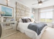 Thumbnail 14 of 42 - Furnished model bedroom with plush carpet