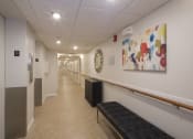 Thumbnail 21 of 35 - Mount Carmel Gardens senior apartments in jacksonville, florida beautiful hallway with seating