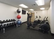 Thumbnail 29 of 35 - Mount Carmel Gardens senior apartments in jacksonville, florida fitness center with cardio and weight equipment
