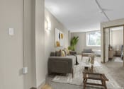 Thumbnail 1 of 28 - the living room of an apartment with a couch and chairs