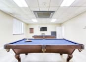 Thumbnail 9 of 12 - pool tables and TV in resident lounge area