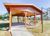 Thumbnail 12 of 12 - Outdoor pavilion with benches and a BBQ grill