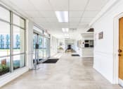 Thumbnail 6 of 12 - lobby entrance to Morris Manor with large windows and reception desk
