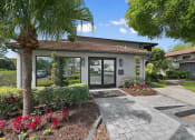 Thumbnail 6 of 32 - Clubhouse Exterior at The Oasis Apartments, Daytona Beach