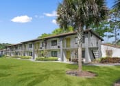 Thumbnail 13 of 32 - Lush Green Landscape at The Oasis Apartments, Daytona Beach, Florida
