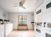 Thumbnail 31 of 32 - Laundry Room at The Oasis Apartments, Daytona Beach, FL, 32114
