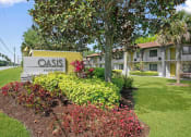 Thumbnail 1 of 32 - Monument Sign at The Oasis Apartments, Florida, 32114