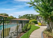Thumbnail 5 of 32 - Poolside Walking Trail at The Oasis Apartments, Florida