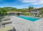 Thumbnail 4 of 32 - Swimming Pool With Relaxing Sundecks at The Oasis Apartments, Daytona Beach
