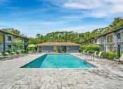 Thumbnail 2 of 32 - Invigorating Swimming Pool at The Oasis Apartments, Daytona Beach, Florida