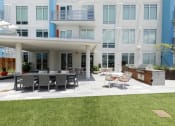 Thumbnail 35 of 42 - grilling patio with dining area on amenity deck at Lake Nona Pixon, Orlando, Florida
