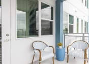Thumbnail 33 of 44 - balcony with model patio set at Residences at The Green in Lakewood Ranch