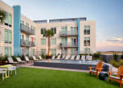 Thumbnail 37 of 42 - Fountain at Lake Nona Pixon surrounded by lounge chairs at Lake Nona Pixon, Florida