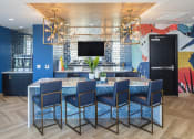 Thumbnail 18 of 42 - Upstairs lounge in Pixon with wine fridge, seating island and tv at Lake Nona Pixon, Orlando