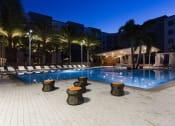 Thumbnail 38 of 42 - Illuminated pool and cabanas at nightfall  at LandonHouse in Lake Nona