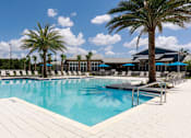 Thumbnail 1 of 30 - Pool and aqua deck with towering palm trees