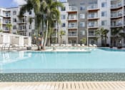 Thumbnail 4 of 42 - Apartments overlooking pool with palm island at LandonHouse Apartments in Lake Nona, Orlando, FL 32827