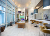 Thumbnail 8 of 44 - Game room with TVs, pool table, and lounge style seating at Residences at The Green