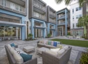 Thumbnail 20 of 44 - outdoor resident lounge with plush couches and chairs by The Green