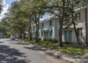 Thumbnail 5 of 32 - Pastel blue, white, and pink apartment homes with mature trees and neat sidewalks at Terraces at Clearwater Beach, Clearwater, 33756