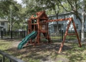 Thumbnail 16 of 32 - Playground with swings and slide at Terraces at Clearwater Beach, Clearwater