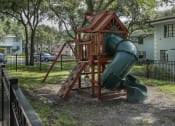 Thumbnail 17 of 32 - Playground with spiral slide at Terraces at Clearwater Beach, Clearwater, 33756