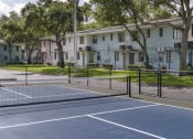 Thumbnail 19 of 32 - Fenced tennis Court at Terraces at Clearwater Beach, Clearwater, FL, 33756