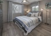 Thumbnail 28 of 32 - Bedroom with two large windows, fan, wood-style floor, and model furnishings at Terraces at Clearwater Beach, Florida
