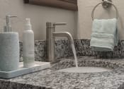 Thumbnail 30 of 32 - Granite countertop and modern fixture in bathroom  at Terraces at Clearwater Beach, Clearwater, Florida