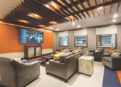Thumbnail 37 of 42 - Theater room with couches and chairs  at LandonHouse in Lake Nona