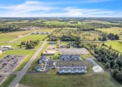 Thumbnail 22 of 24 - a birds eye view of a farm with houses and a parking lot