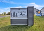 Thumbnail 24 of 24 - the sign for cedar ridge in front of a house