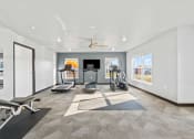 Thumbnail 19 of 24 - a gym with exercise machines and a ceiling fan
