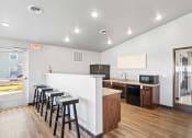 Thumbnail 15 of 24 - the preserve at ballantyne commons community kitchen and bar with stools