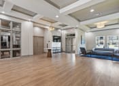 Thumbnail 25 of 57 - a large living room with a hard wood floor and windows