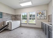 Thumbnail 46 of 57 - a large bathroom with a sink and a window