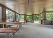 Thumbnail 54 of 57 - the gathering space is filled with benches and tables