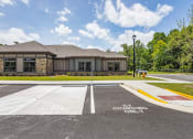 Thumbnail 51 of 57 - an empty parking lot in front of a building