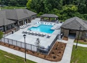Thumbnail 50 of 57 - an aerial view of a resort style pool with lounge chairs