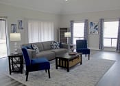 Thumbnail 1 of 8 - comfortable seating, large windows, and a coffee table in the office at Woodland Villas Apartments, Jasper, 35504