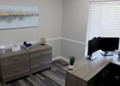 Thumbnail 3 of 8 - leasing office with furnishings and decor at Woodland Villas Apartments, Jasper, AL 35504